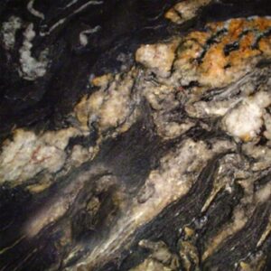 Titanium granite slab with natural black, gold, and white veining by Tile for Less in Seattle, WA