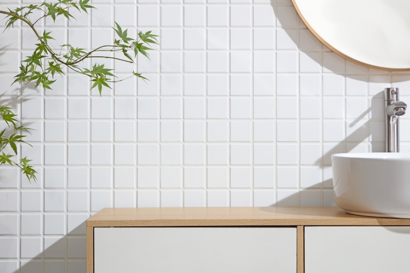 White Square Tile Wall with Wooden Vanity